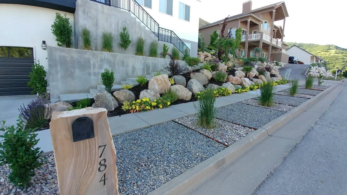 Residential landscape with stonework and planting